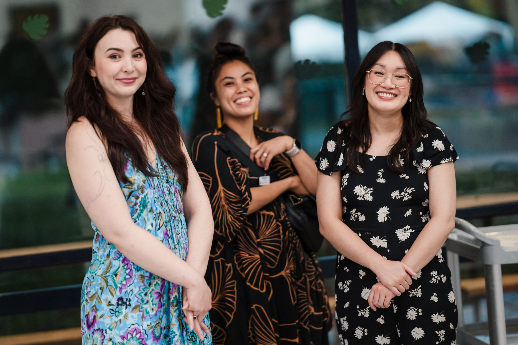Three adult women smiling