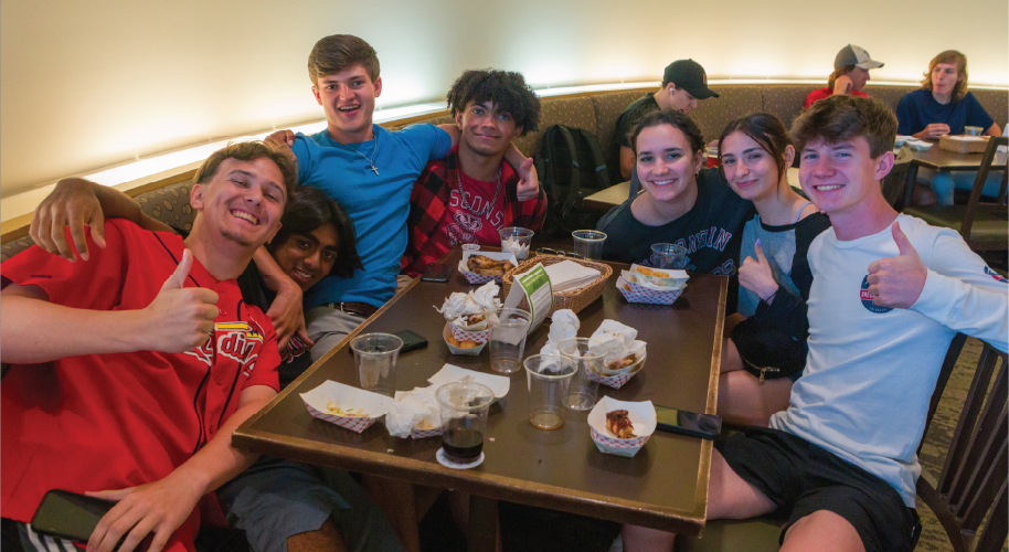 Students pose for photo in Four Lakes dining area