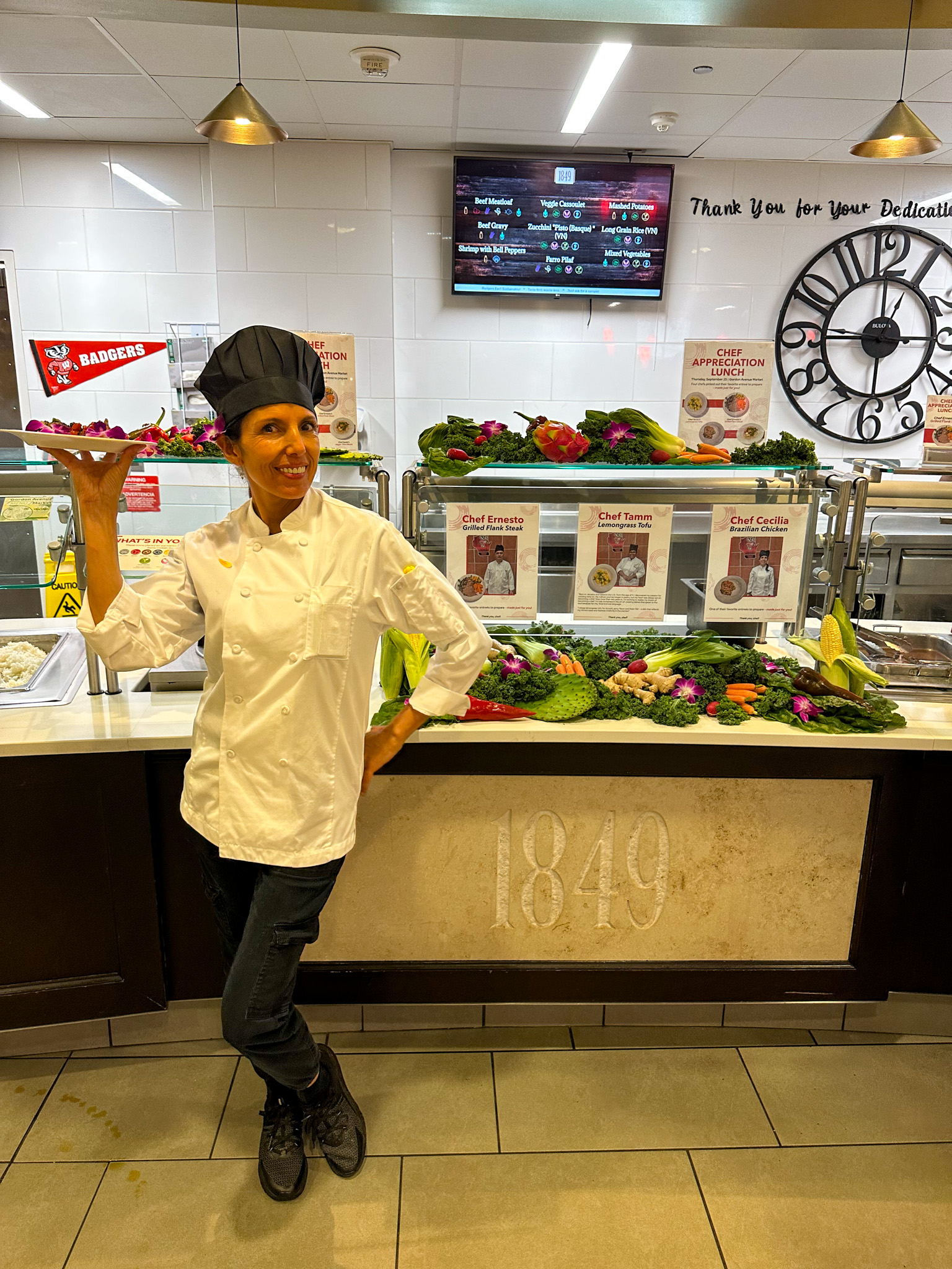 Chef Cecilia posing with her special entree at the Chef Appreciation lunch in Gordon Avenue Market