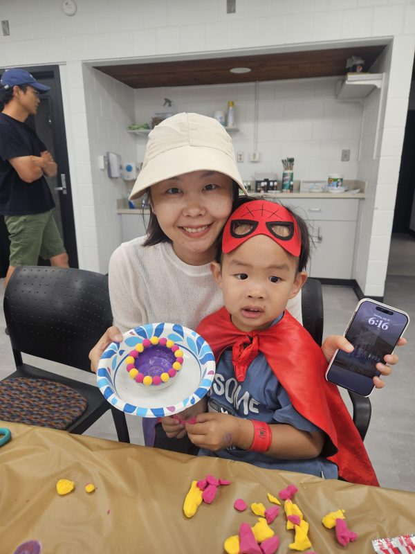 mother and son smiling at camera