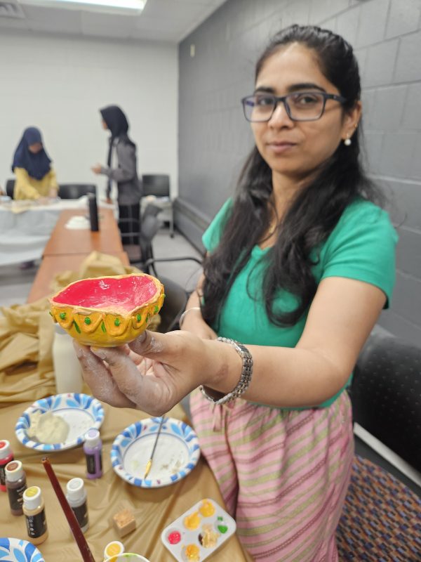 person with brown hair showing art
