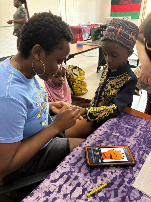 Eagle's Wing students showing bracelets
