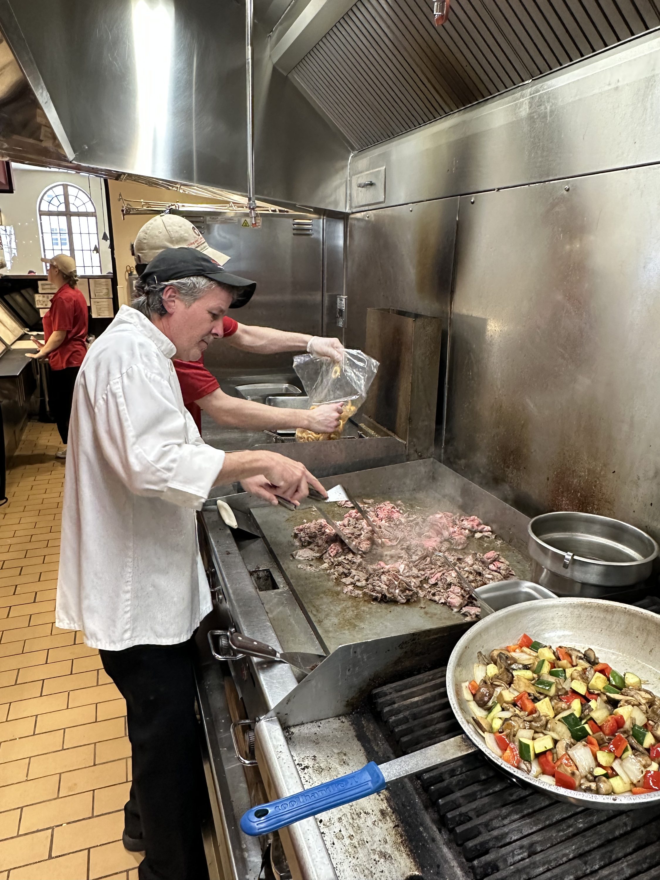 Chef making philly cheesesteaks