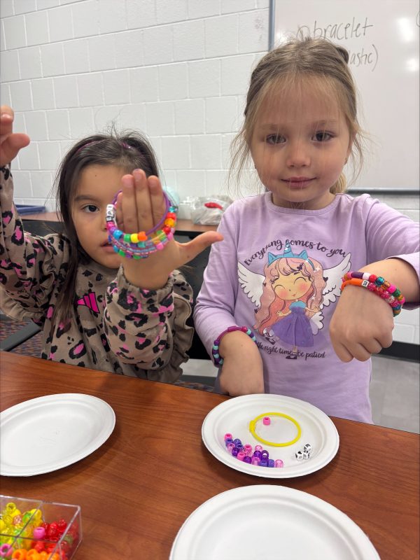 Eagle's Wing students showing bracelets
