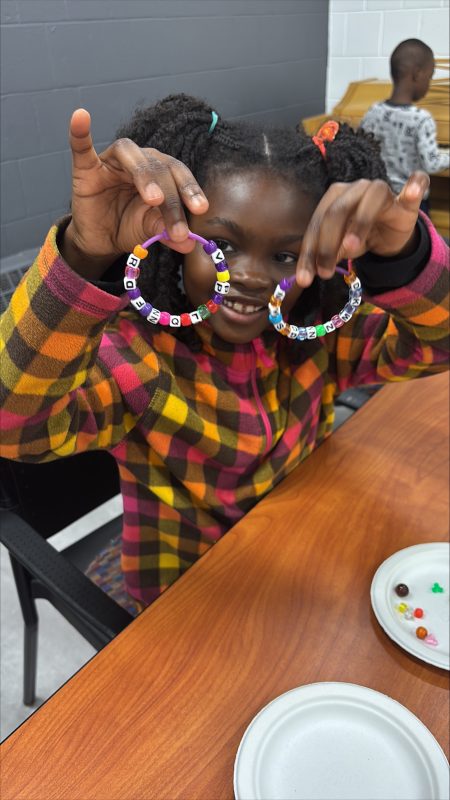 child showing jewelry made