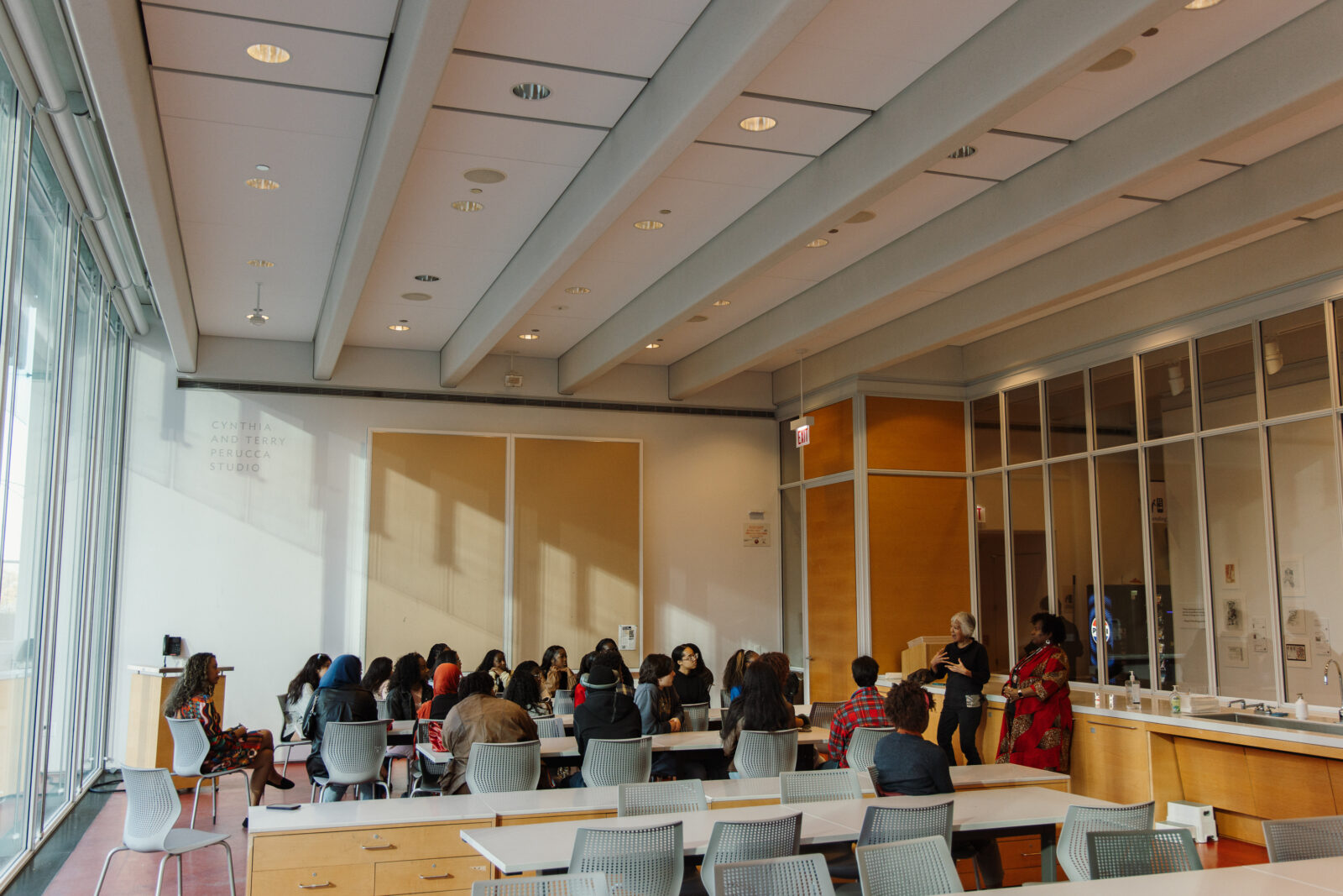A group of people sitting ina meeting room.