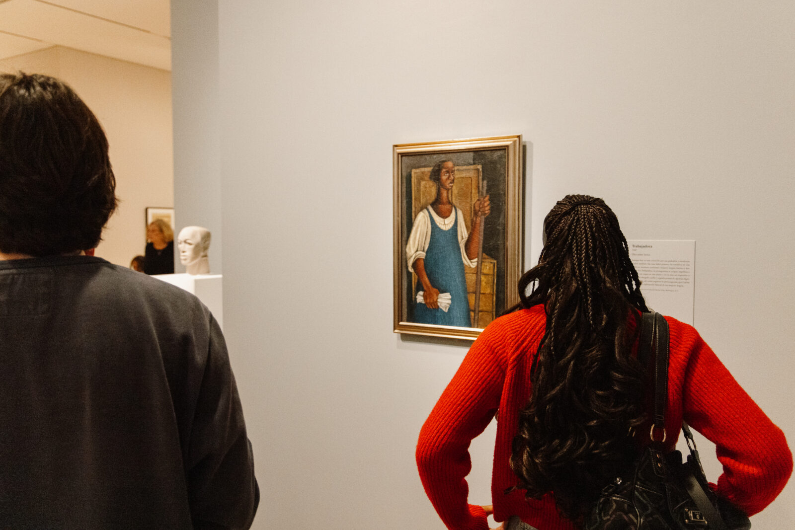 Two people looking at artwork