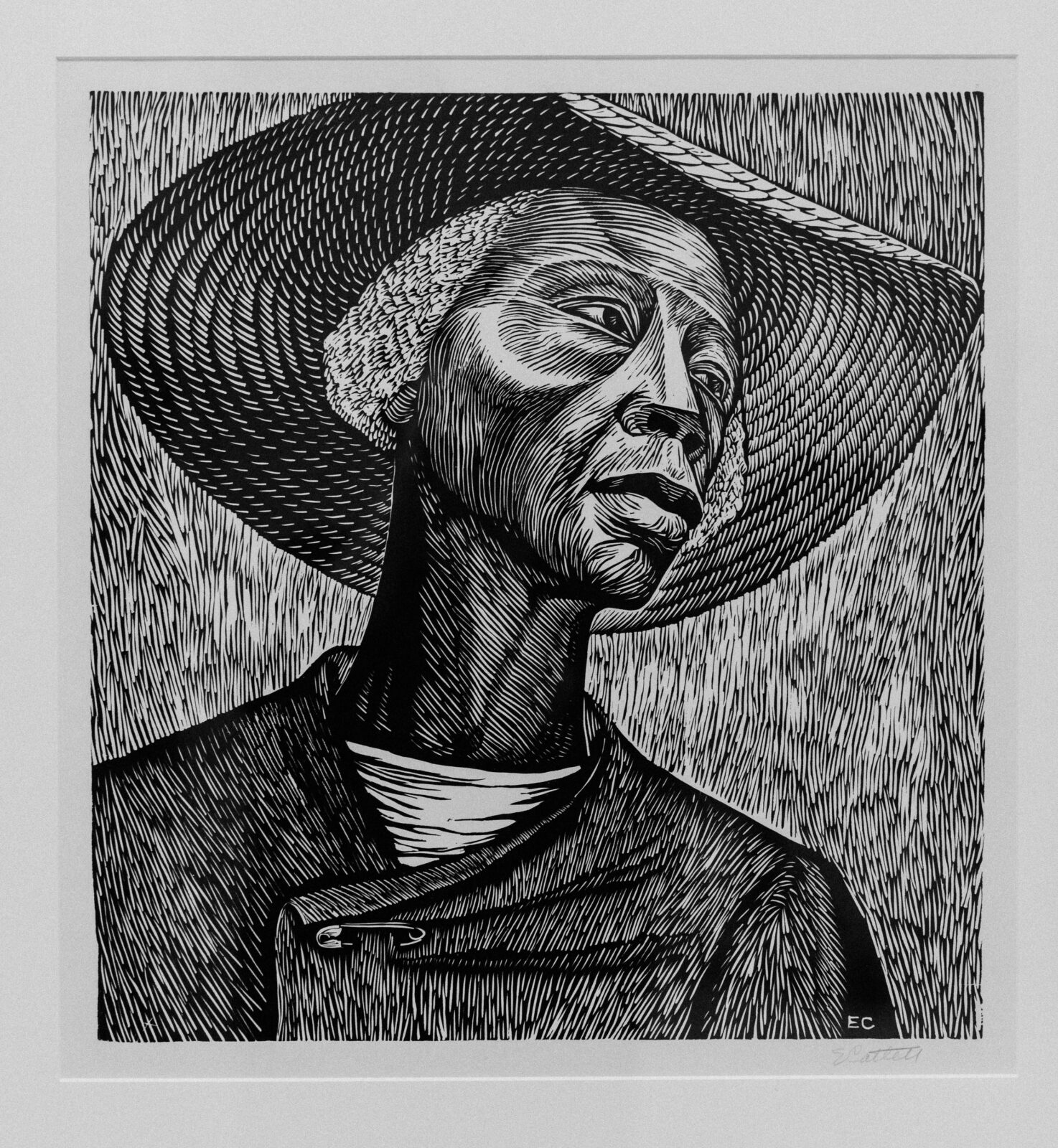 Black and white artwork of a person wearing a straw hat.