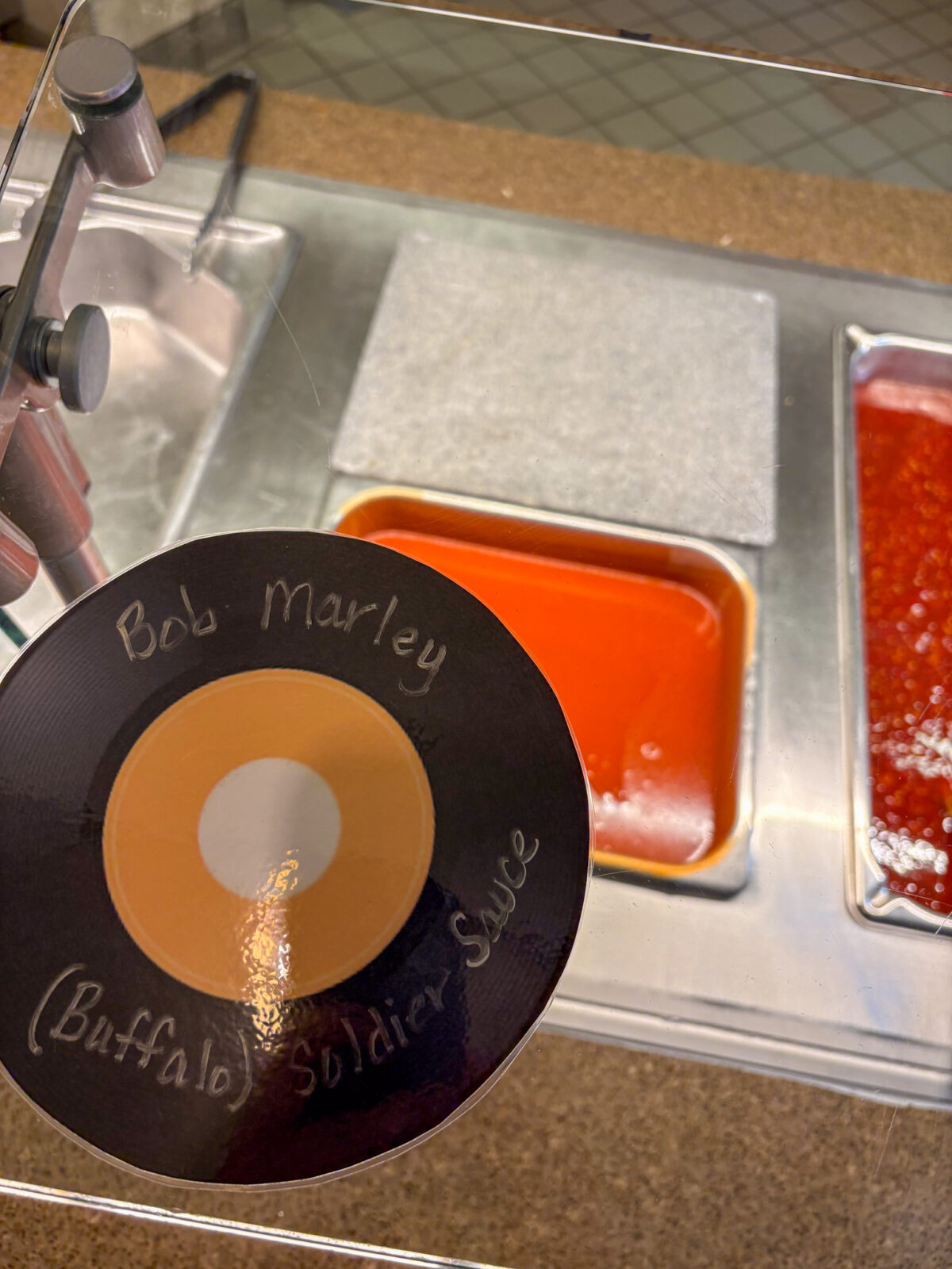 Bob Marley (Buffalo) Soldier Sauce record with buffalo sauce in the background