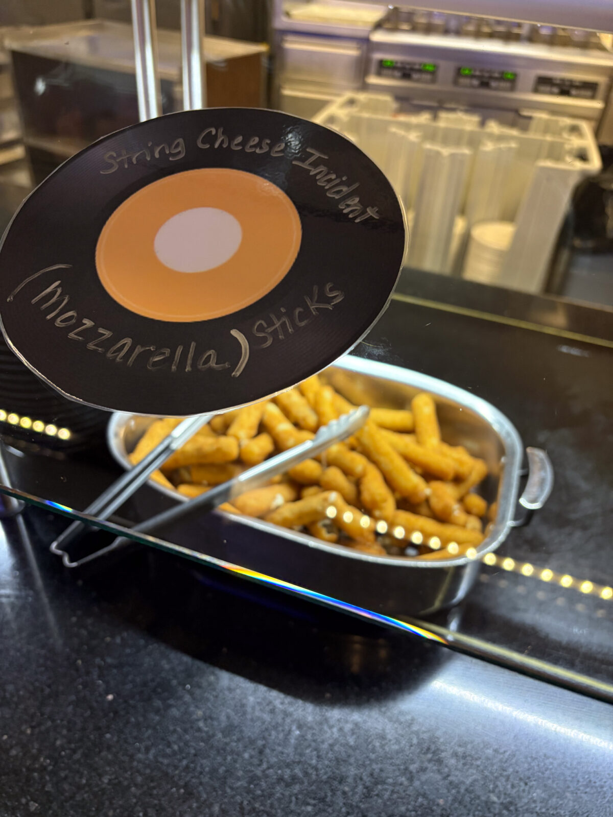 String Cheese Incident record sign with mozzarella sticks in the background