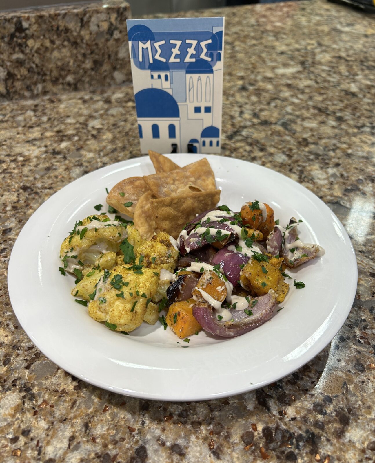 Plate of mezze food with sign