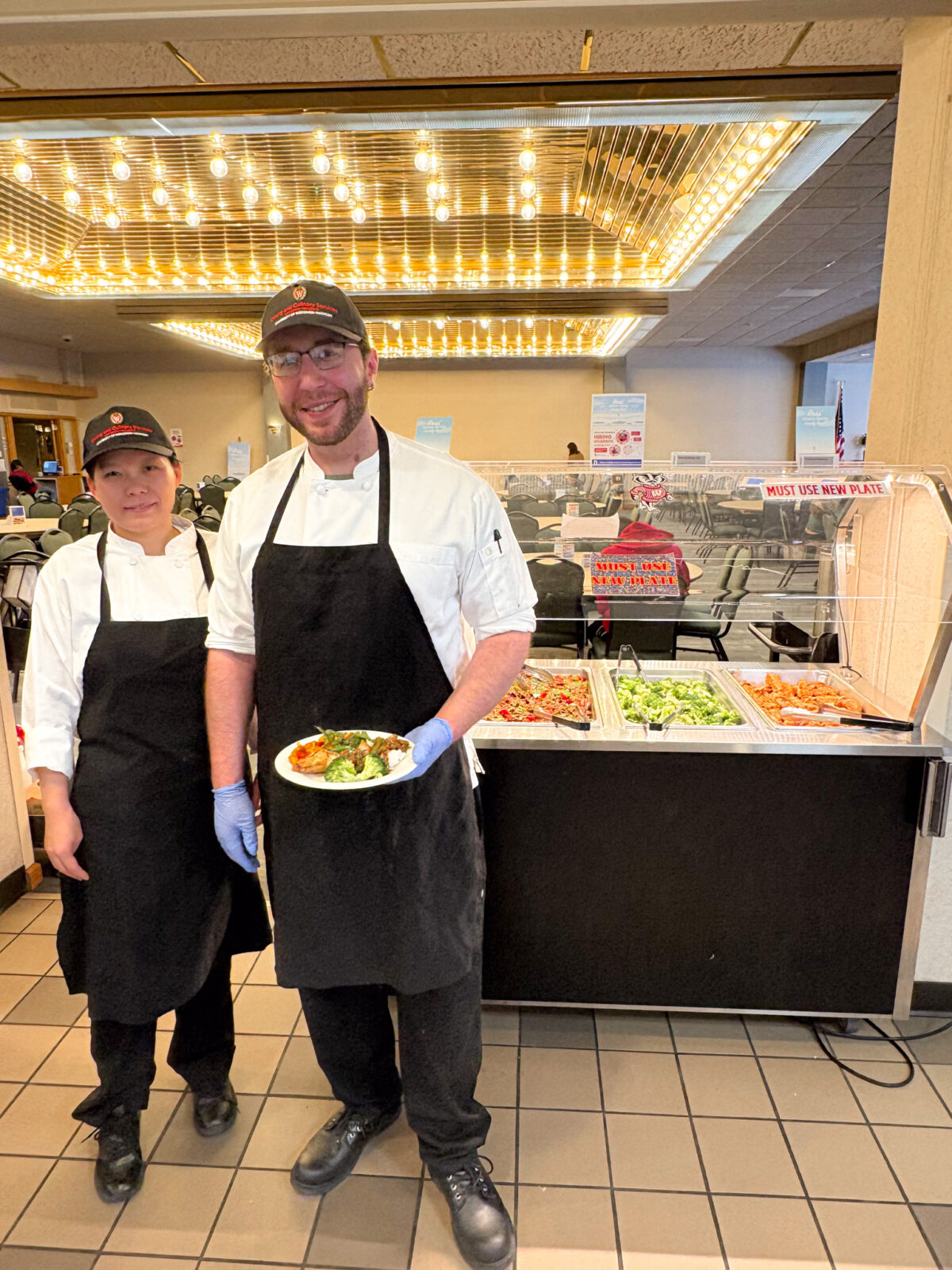 Chefs pose for photo in Lowell Market