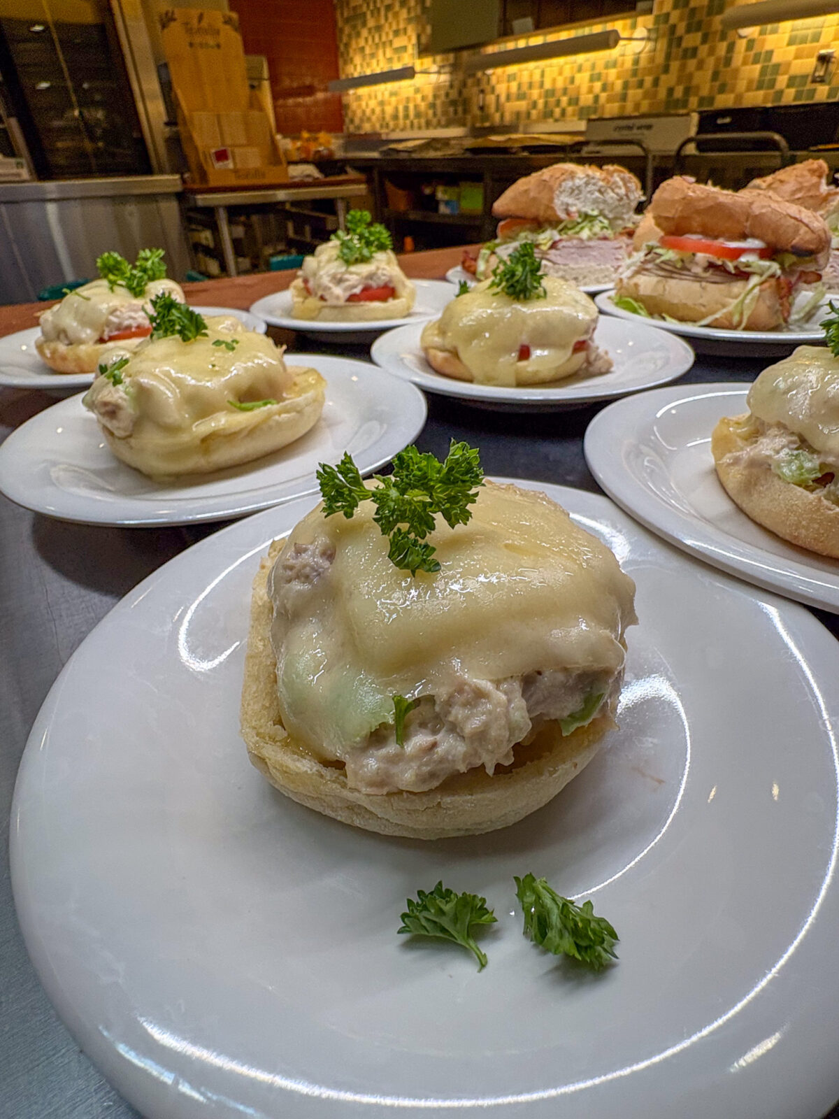 Plates of Big Easy tuna melts at dining's Mardi Gras event