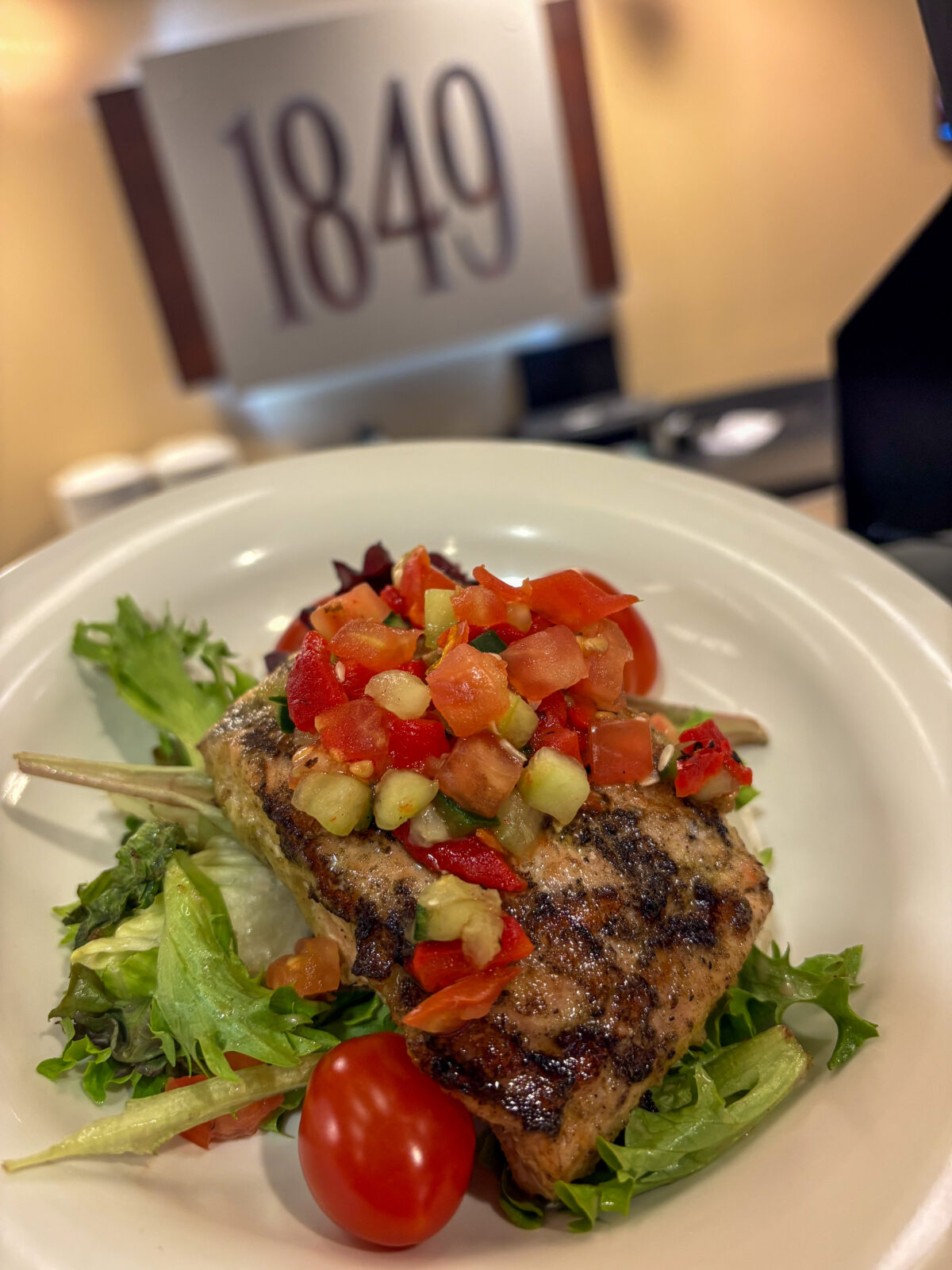 Plated Rosemary Grilled Salmon Salad at Rheta's Seafood Celebration dinner