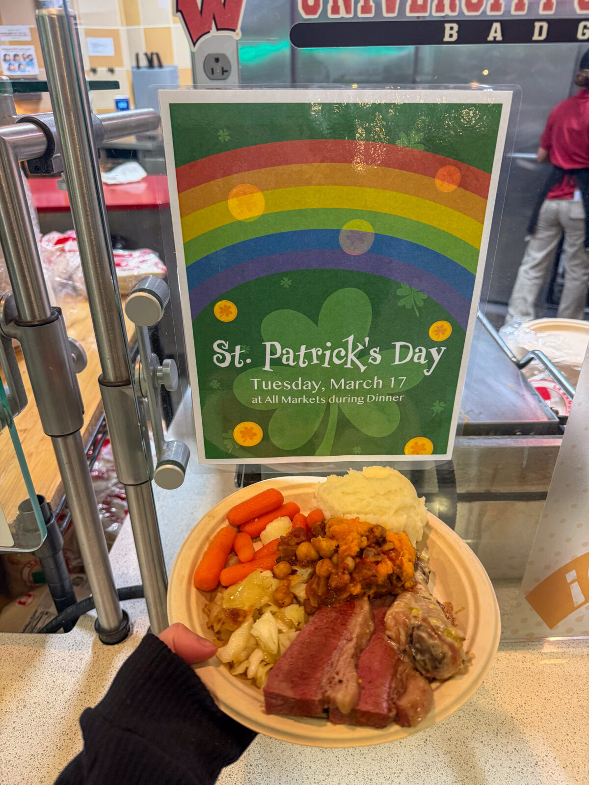 Special dish at dining's St. Patrick's day event with sign in back