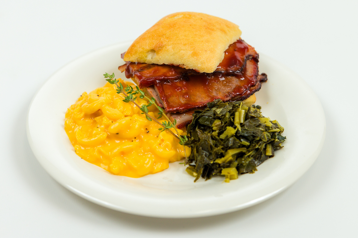 BBQ sandwich with mac and cheese and collard greens