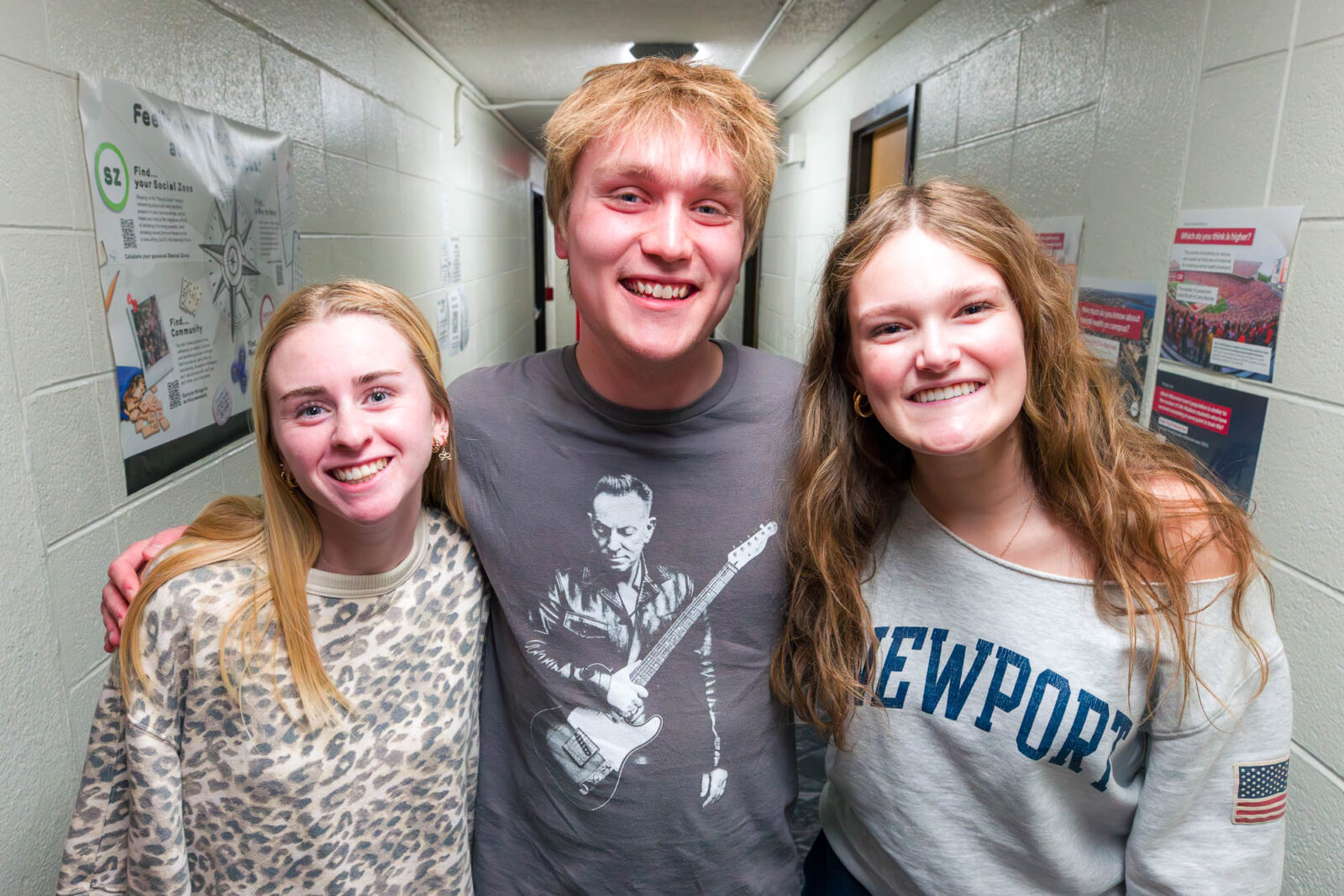 Michael poses for a photo with two residents in Bradley Residence Hall.