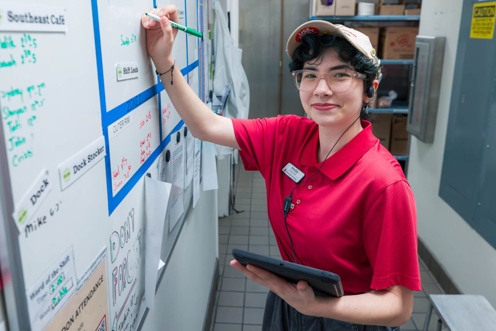 Maddy makes changes to the student schedule at Gordon Avenue Market.