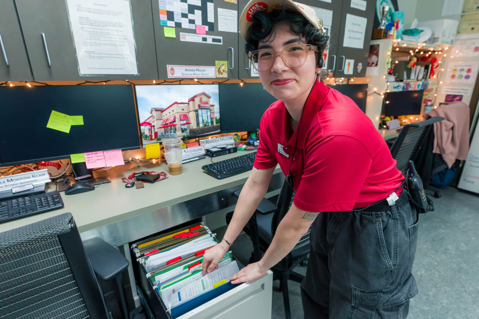 Maddy places a file in storage in the staff offices at Gordon Avenue Market.