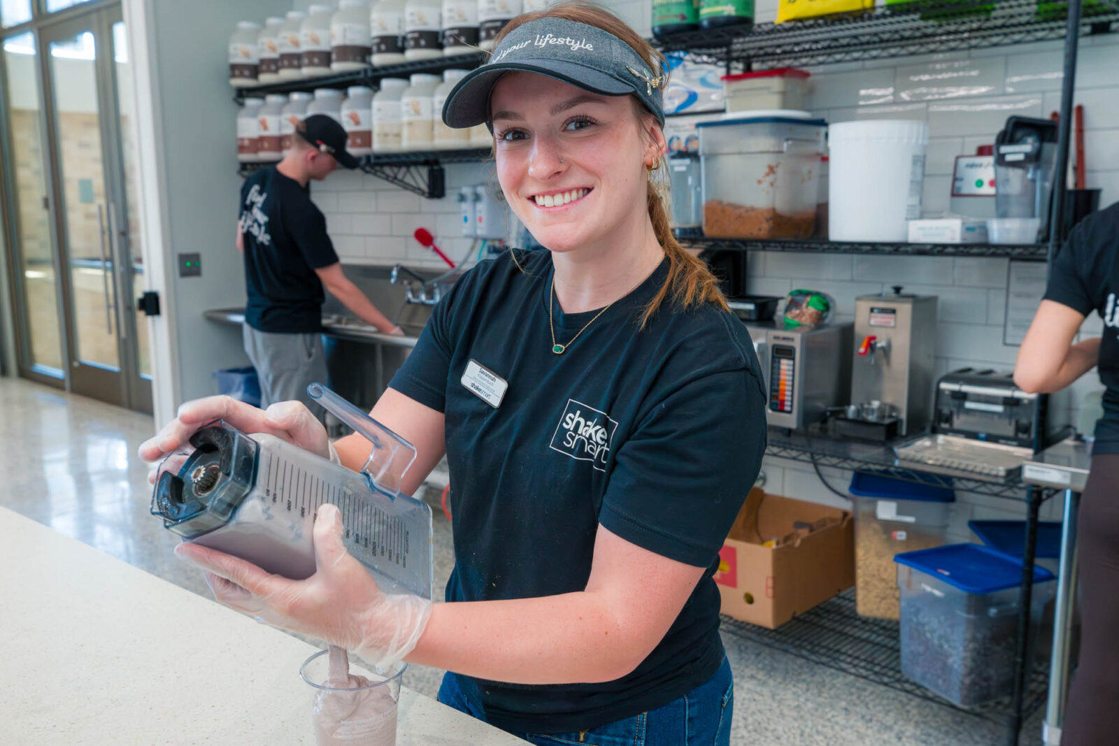 Savannah pours a shake at Shake Smart in the Bakke Recreation & Wellbeing Center.