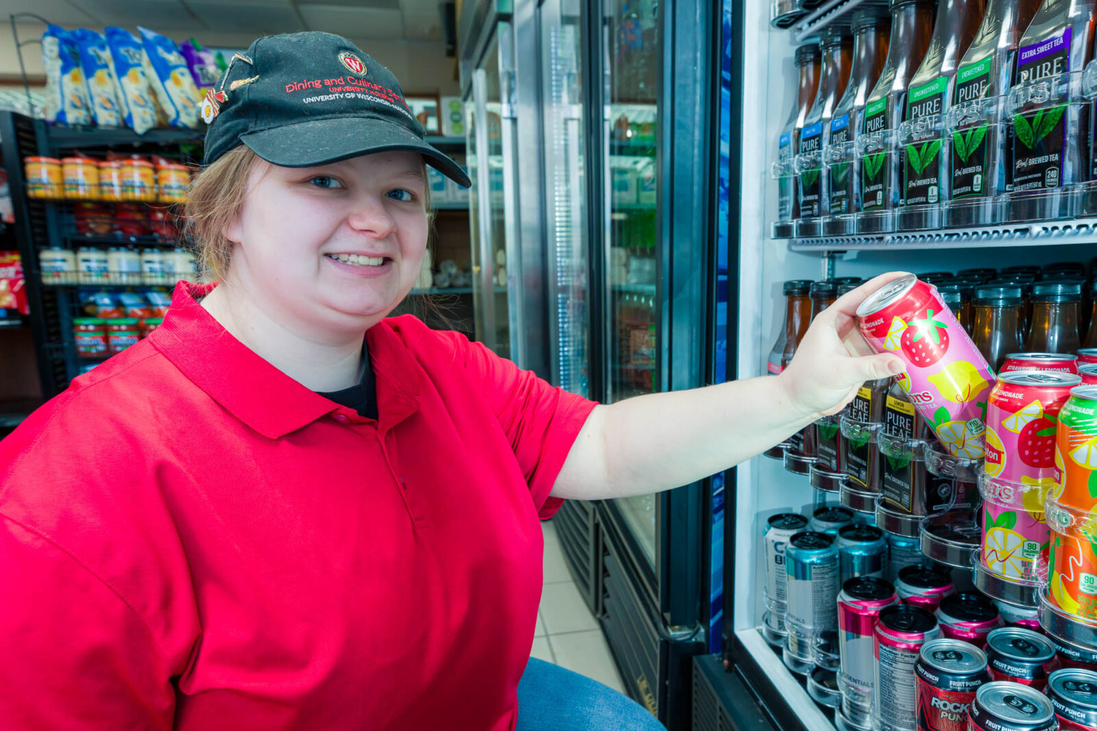 Jaedyn checks products in the Flamingo Run at Rheta's Market in Chadbourne Residence Hall.