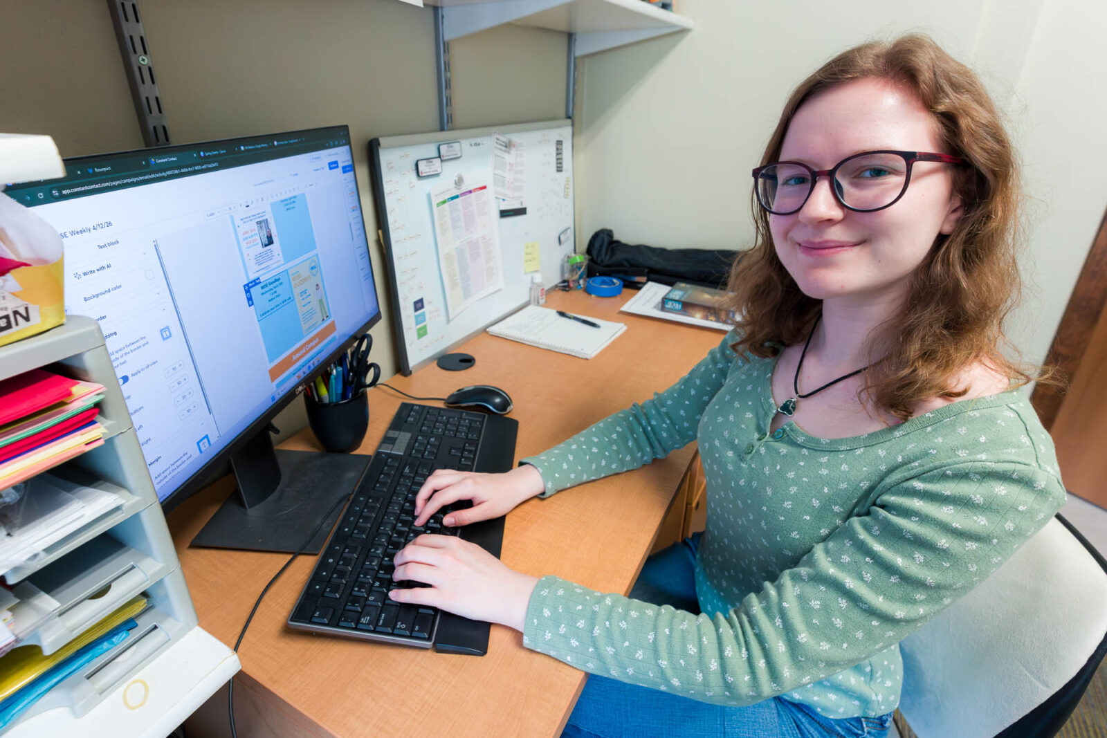 Elise works on the WISE Learning Community email newsletter in Waters Residence Hall.