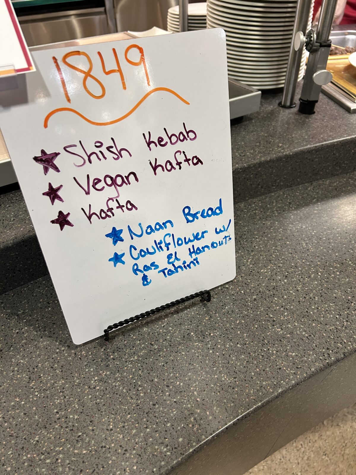 Rheta's Market Street Foods event station whiteboard sign
