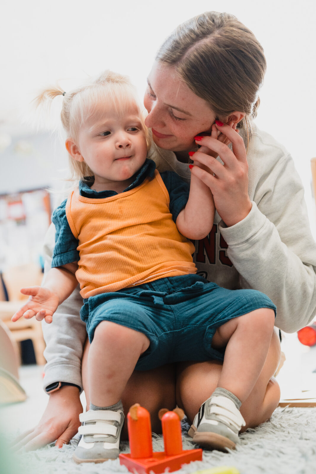 Becca working with a toddler,