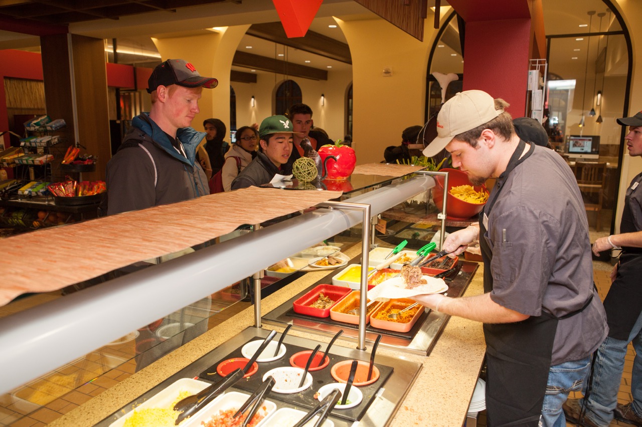 Dining staff serving students at Carson's Market