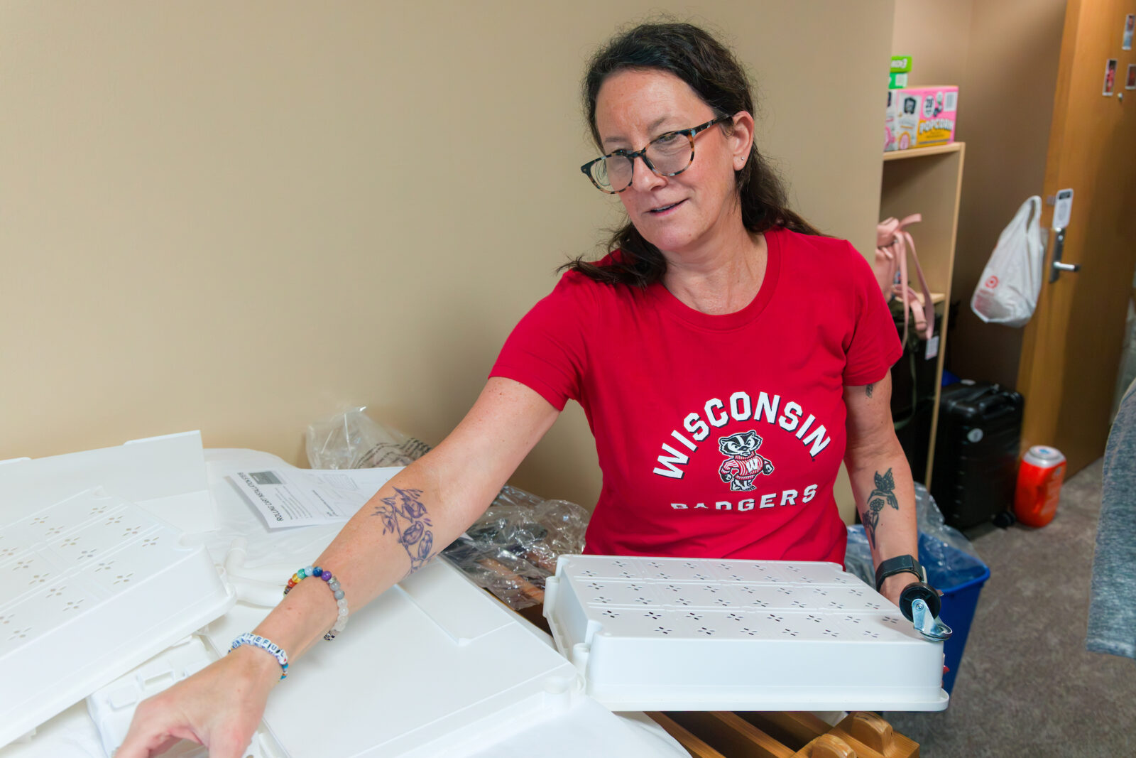 A person putting together shelving