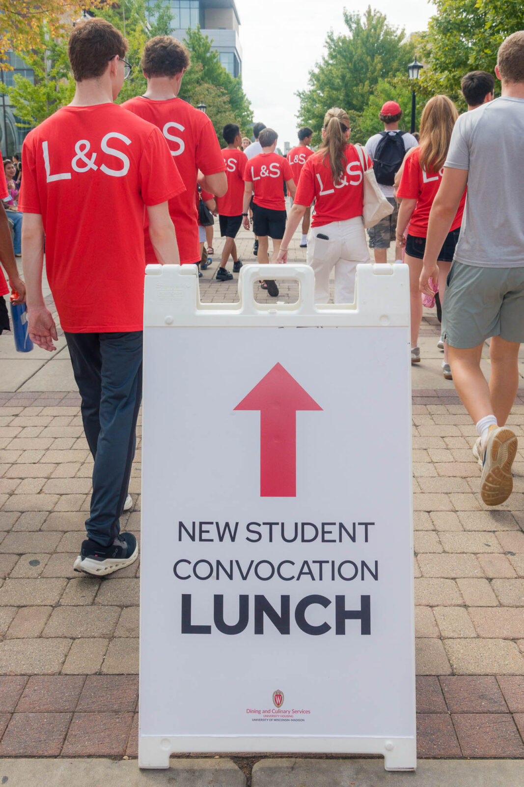 A sign reading "New Student Convocation Lunch"