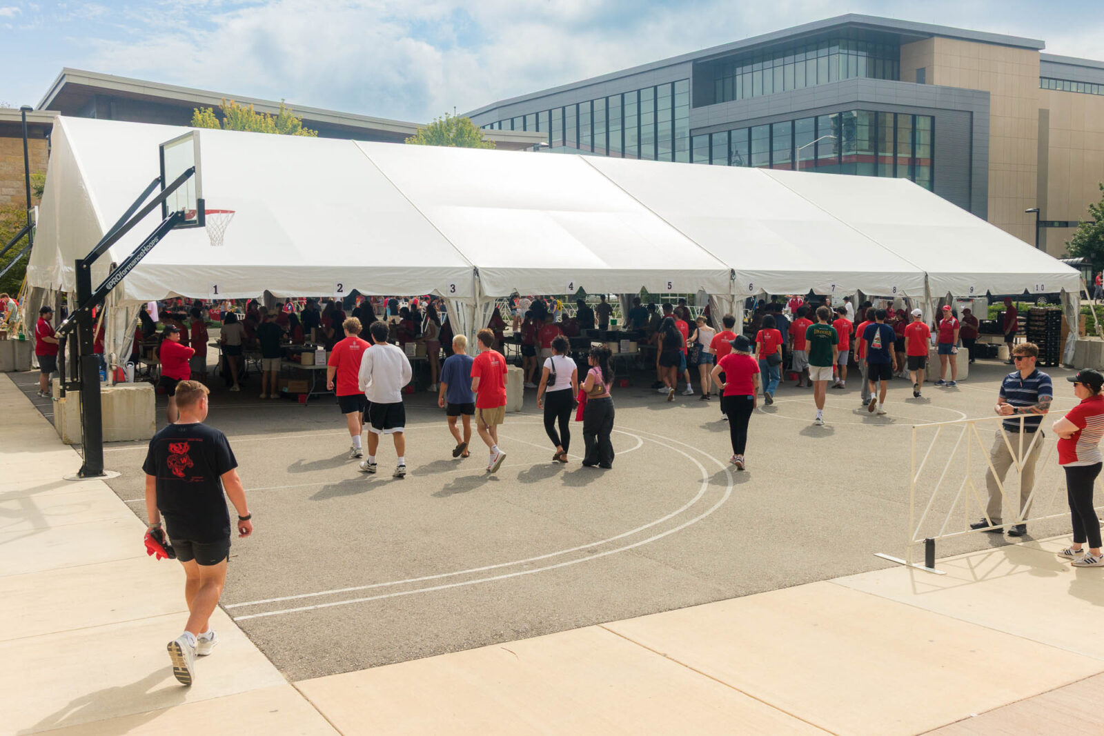 A large tent with people walking up to it