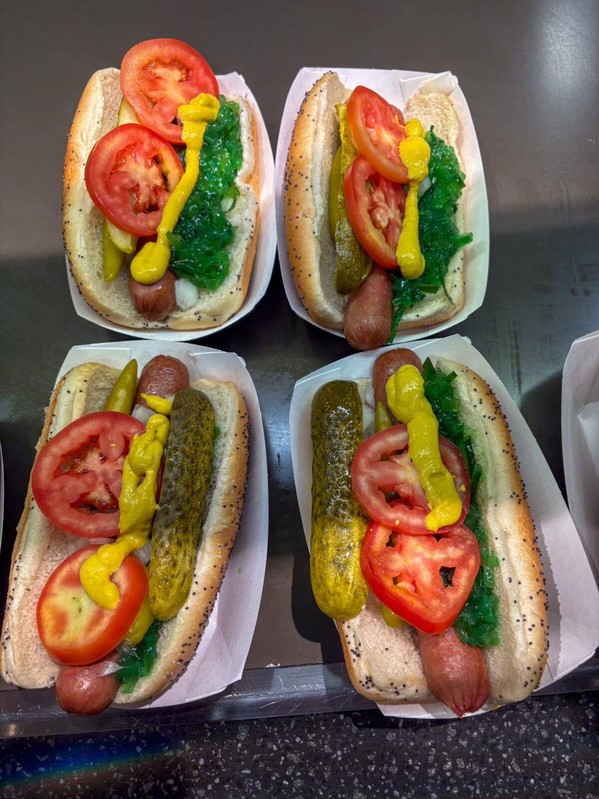 Four Chicago-style hot dogs